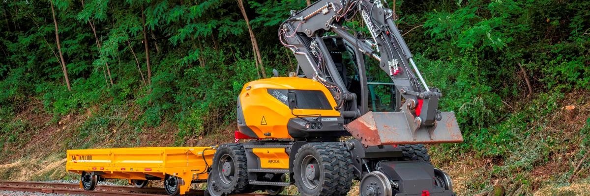 Mecalac 215M Rail met aanhanger.